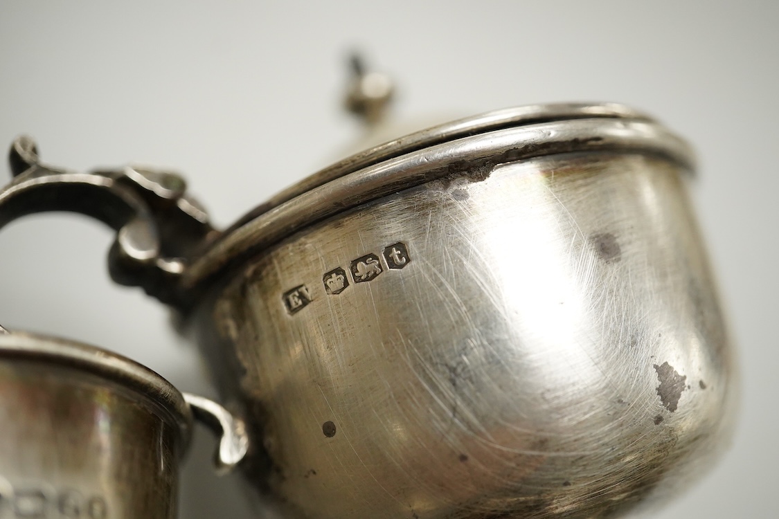 An Elizabeth II silver mounted vase with wavy border, Adie Brothers, Birmingham, 1955, weighted, 20.4cm, a silver mounted glass swan bonbon dish, a George V silver three piece condiment set, a silver mounted glass toilet